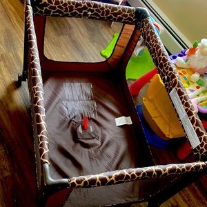 Pack and play. Cheetah print. No mattress pad. Cheap cheap price. OBO